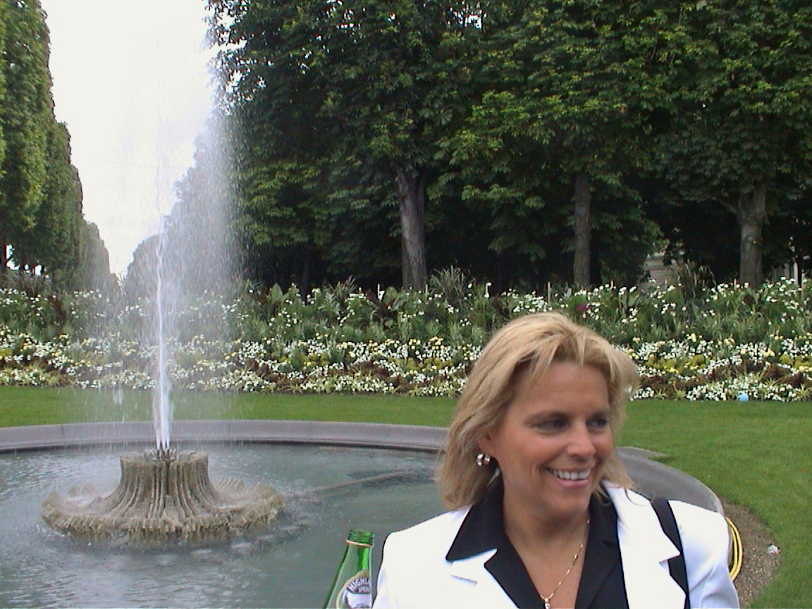 Kathy Fields at a fountain in the Champs
